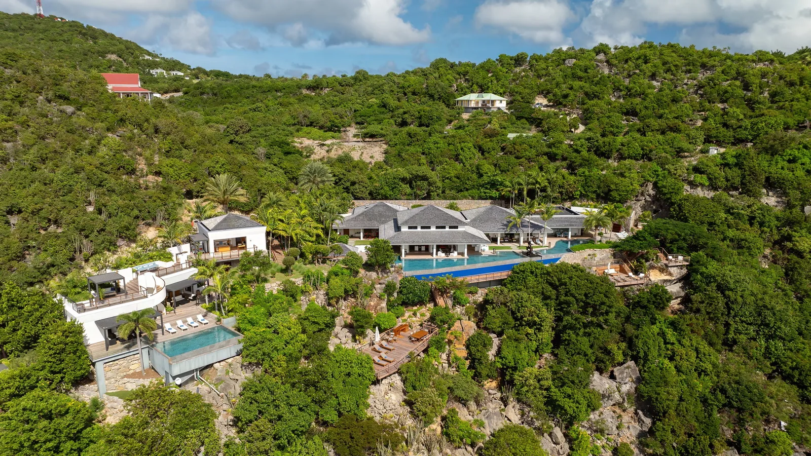 Villa Amitie seen from the approach, set on the slope above Gouverneur