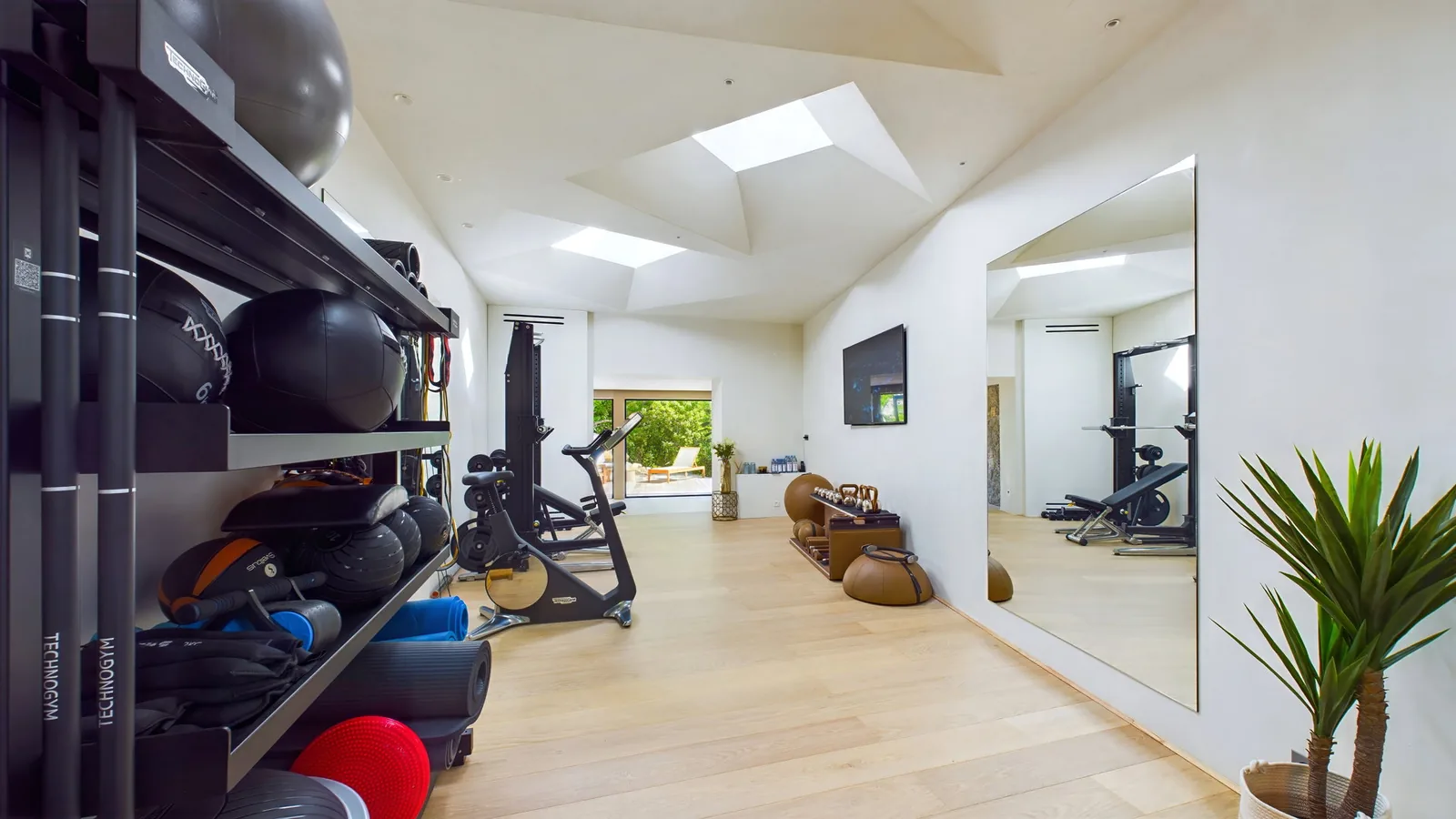 Fitness equipment in the gym area at Villa Amitie