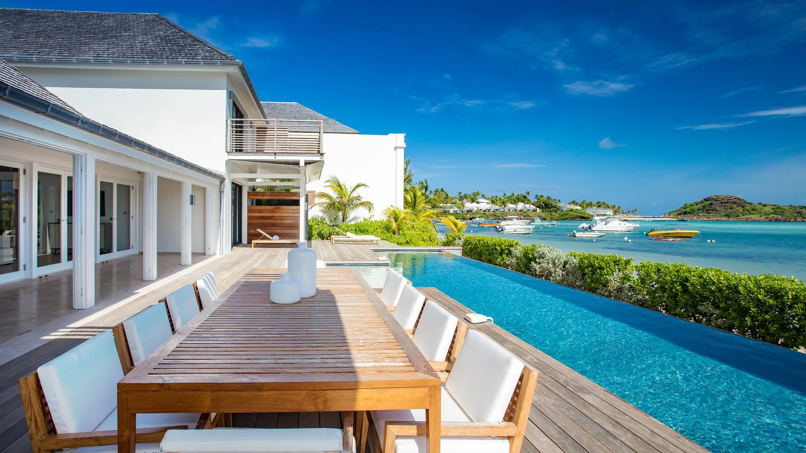 Outdoor grill and dining setup at Aquablue Estate