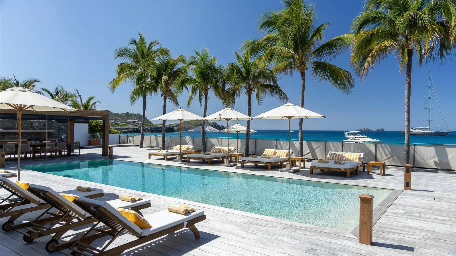 Pool at Sand Club with the terrace running alongside it